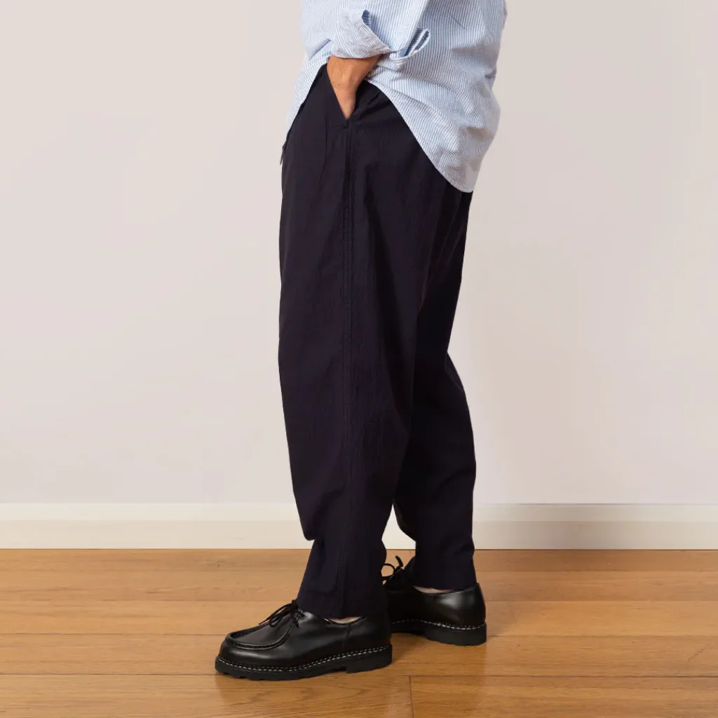 Trousers|Universal Works Pleated Track Pant - Navy Seersucker